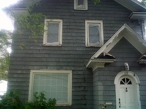 Before picture showing proper exterior residential paint preparation