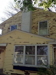 1920's built East Lansing home exterior painting project before more than 50 hours of scraping prepares the house for painting by Full Color Painting LLC