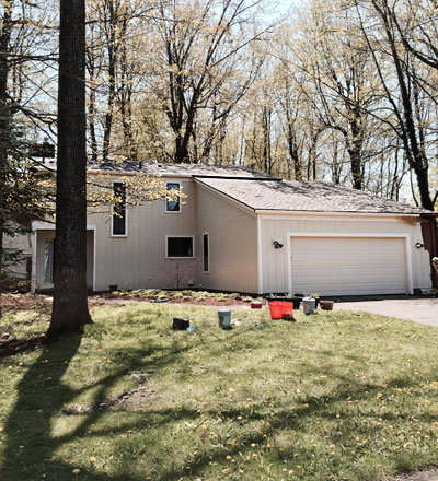 A house transformed with a residential painting job facelift from a recent home painting project in the Greater Lansing Michigan area.